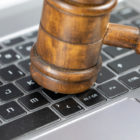 Gavel on computer keyboard