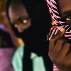 war crimes victims interview Sudanese girls seen in Darfur, Sudan, June 25, 2005. The 12-year-old girl wearing the striped scarf, front, tells how she was separated from her two friends, and raped by soldiers from the Sudanese government.